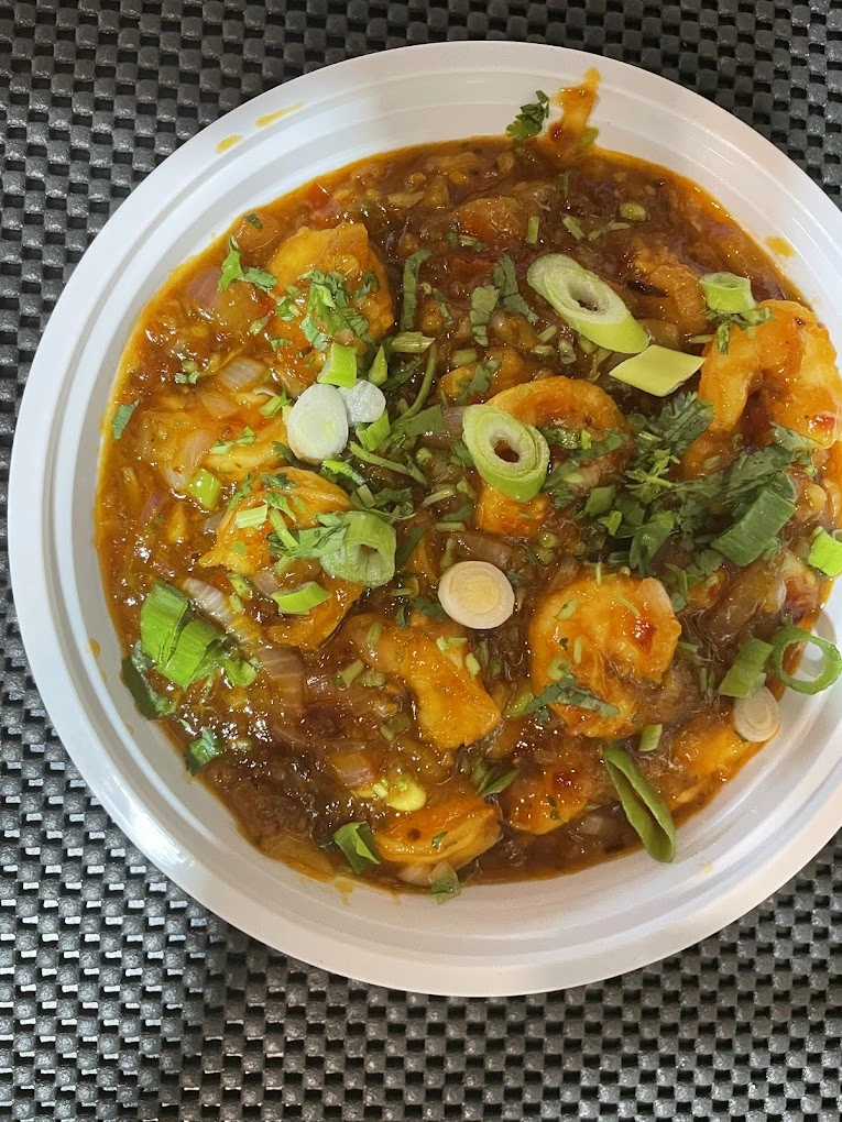 Chicken biryani with aromatic spices at Tandoori Kitchen Heritage Square