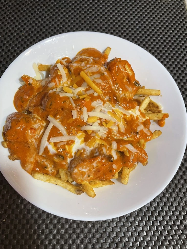 Fish pakora and vegetarian dishes at Tandoori Kitchen Indian restaurant Edmonton