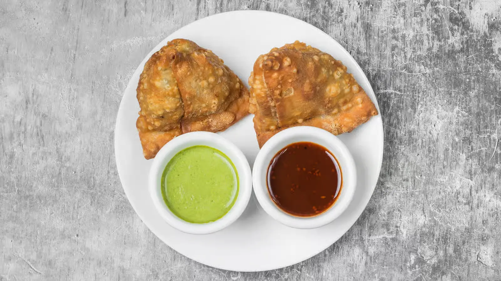 Vegetable samosas at Tandoori Kitchen Edmonton - crispy pastry with spiced potato and peas filling