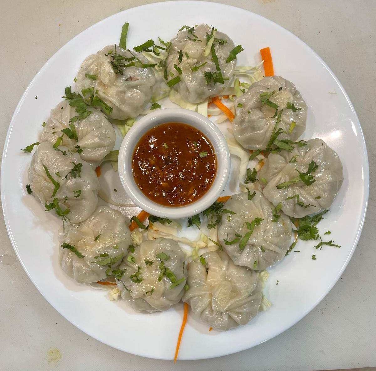 Chicken steam momos at Tandoori Kitchen Edmonton - steamed dumplings with spiced chicken filling