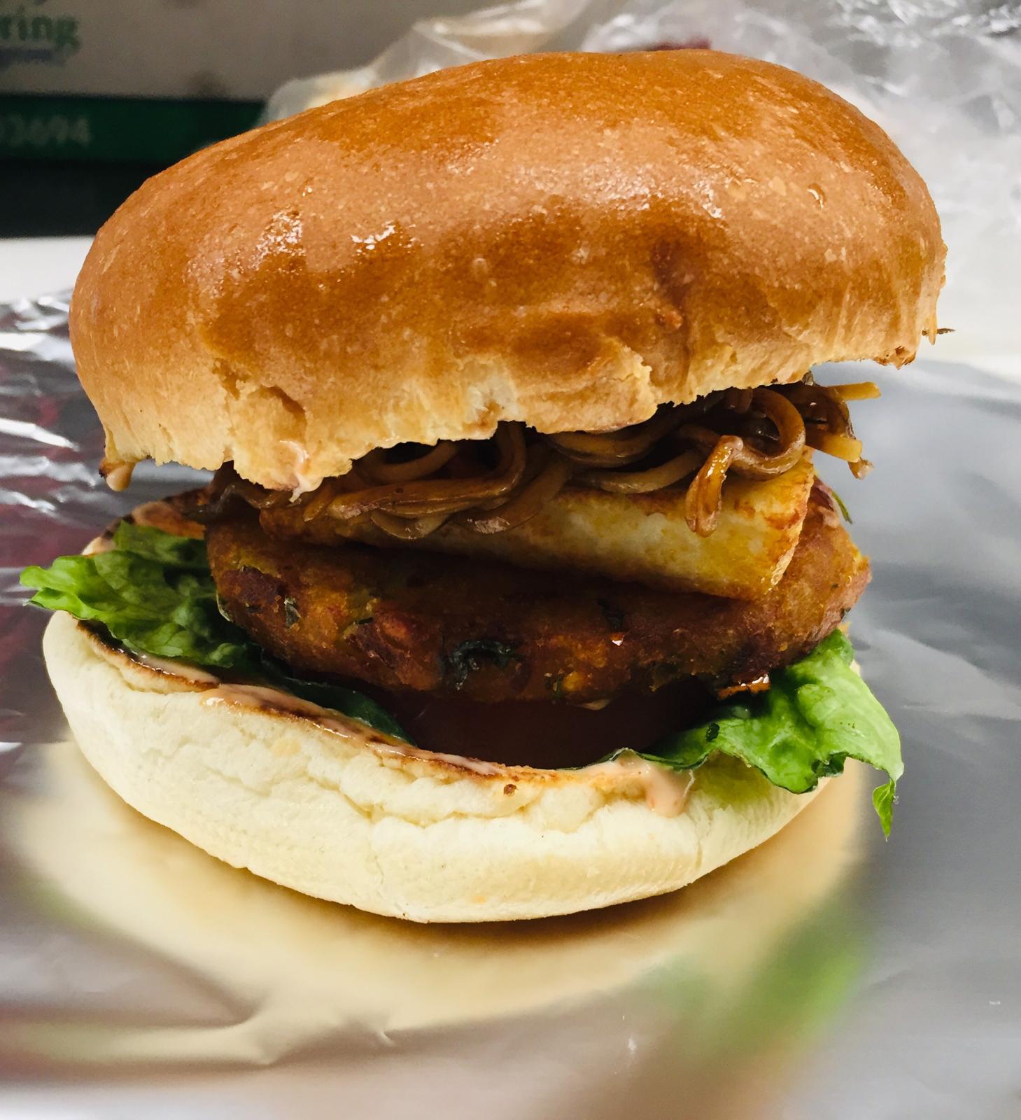 Paneer tikki burger at Tandoori Kitchen Edmonton - spiced paneer patty in a burger bun